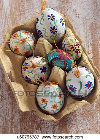 Stock Photo - Painted eggs in an egg carton. Fotosearch