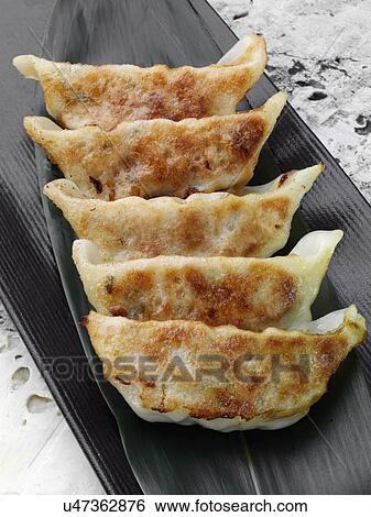 Pan fried gyoza View Large Photo Image Stock Photograph - Pan fried gyoza. Fotosearch