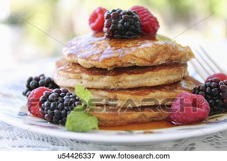 Stock Photo - Pancakes Served With Summer Berries And Syrup. Fotosearch