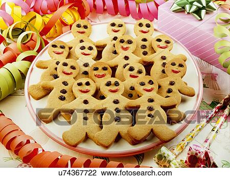 Party Table With Plate Full Of Gingerbread Men Biscuits Or Cookies View Large Photo Image Stock Image - Party Table With Plate Full Of Gingerbread Men Biscuits Or Cookies. Fotosearch