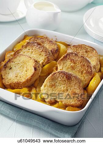 Peach cobbler whole in a serving dish View Large Photo Image Stock Image - Peach cobbler whole in a serving dish. Fotosearch