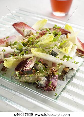 Stock Photo - Pear endive salad with Gorgonzola cheese and walnuts. Fotosearch