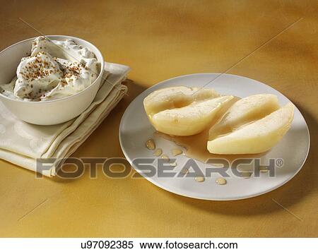 Pears in rum with whipped cream dusted with sucanat drizzled with poaching liquor View Large Photo Image Stock Photography - Pears in rum with whipped cream dusted with sucanat drizzled with poaching liquor. Fotosearch