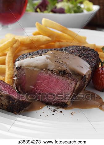 Peppered fillet steak with French fries Marco Pierre White recipe View Large Photo Image Stock Image - Peppered fillet steak with French fries Marco Pierre White recipe. Fotosearch