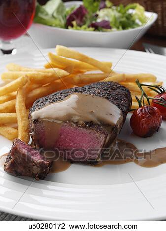 Peppered fillet steak with French fries Marco Pierre White recipe View Large Photo Image Stock Image - Peppered fillet steak with French fries Marco Pierre White recipe. Fotosearch