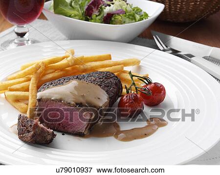 Peppered fillet steak with French fries Marco Pierre White recipe View Large Photo Image Stock Photo - Peppered fillet steak with French fries Marco Pierre White recipe. Fotosearch