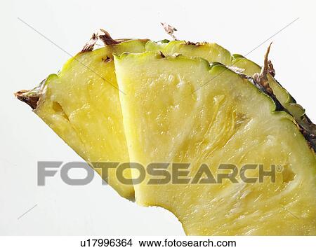 Pineapple slices on a white background View Large Photo Image Picture - Pineapple slices on a white background. Fotosearch