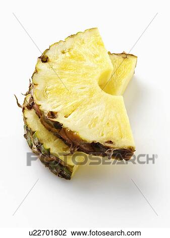 Stock Image - Pineapple slices on a white background. Fotosearch