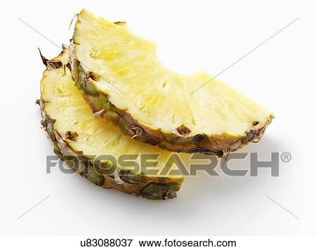 Stock Photo - Pineapple slices on a white background. Fotosearch