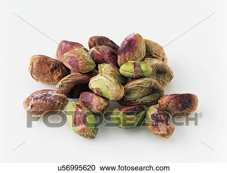 Stock Image - Pistachio nuts on a white background. Fotosearch