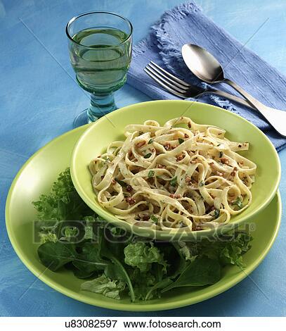 Stock Photo - Plate Of Fettuccine With Salad Leaves. Fotosearch