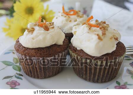 Picture - Plate Of Homemade Carrot Cake Cupcakes. Fotosearch