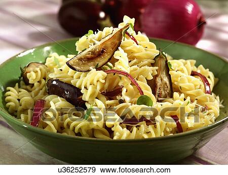 Stock Photo - Plate Of Homemade Eliche With Baby Aubergine. Fotosearch