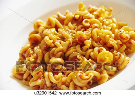Stock Image - Plate Of Pasta Spirals With Tomato Sauce. Fotosearch