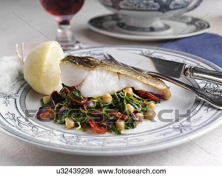 Pollock or pollack with garbanzo beans and spinach View Large Photo Image Stock Photo - Pollock or pollack with garbanzo beans and spinach. Fotosearch