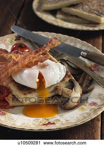 Stock Image - Potato farls bacon egg and mushrooms Irish breakfast. Fotosearch