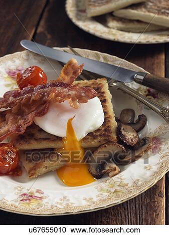 Stock Image - Potato farls bacon egg and mushrooms Irish breakfast. Fotosearch