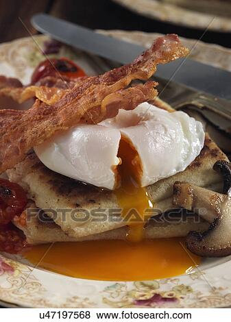 Potato farls bacon poached egg mushrooms Irish breakfast View Large Photo Image Stock Photo - Potato farls bacon poached egg mushrooms Irish breakfast. Fotosearch