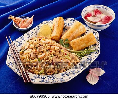 Prawn Or Shrimp Stir Fried Rice With Spring Rolls On White And Blue Plate, Blue Tabletop With Chopsticks And Bowl Of Rose Petals View Large Photo Image Stock Photography - Prawn Or Shrimp Stir Fried Rice With Spring Rolls On White And Blue Plate, Blue Tabletop With Chopsticks And Bowl Of Rose Petals. Fotosearch