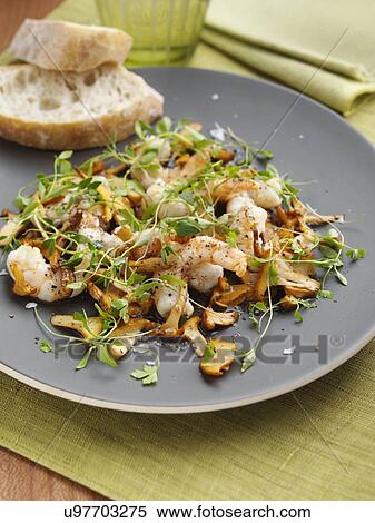 Stock Photography - Prawns and girolle mushrooms. Fotosearch