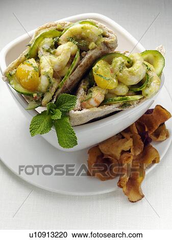 Stock Image - Prawns in pitta bread. Fotosearch