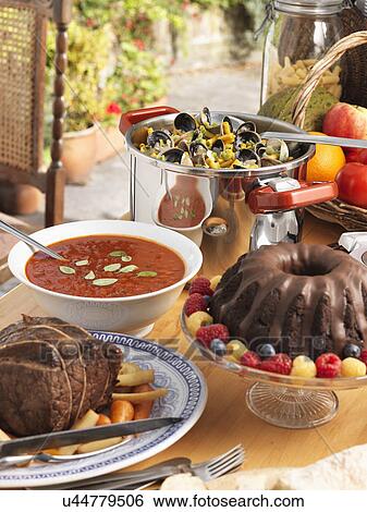 Pressure cooker beef pot roast tomato soup chocolate truffle ring cake clams macaroni View Large Photo Image Stock Photograph - Pressure cooker beef pot roast tomato soup chocolate truffle ring cake clams macaroni. Fotosearch