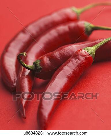 Red Chilli Peppers On Red Background View Large Photo Image Stock Image - Red Chilli Peppers On Red Background. Fotosearch