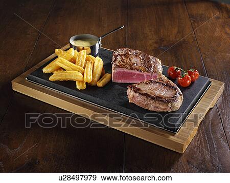 Rib eye steak and chips View Large Photo Image Stock Photo - Rib eye steak and chips. Fotosearch