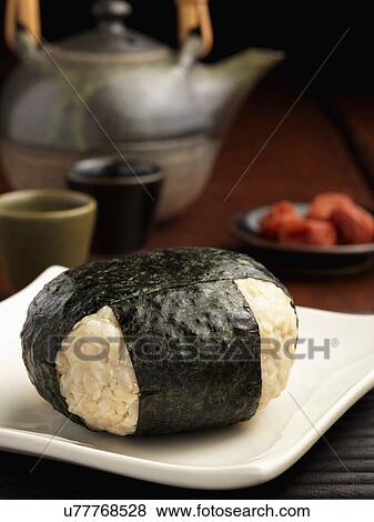 Stock Photo - Rice ball wrapped in seaweed. Fotosearch