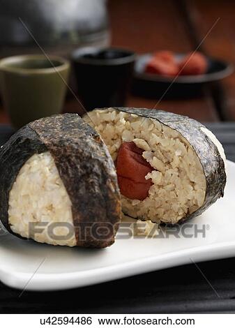 Stock Photograph - Rice ball wrapped in seaweed. Fotosearch