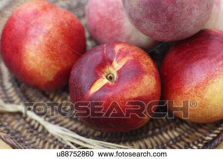 Stock Image - Ripe fresh nectarines. Fotosearch