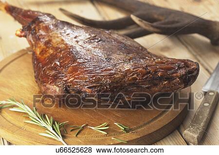 Stock Photo - Roast Haunch Of Venison Ready To Carve. Fotosearch