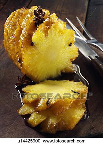Stock Image - Roast pineapple with Chinese spices. Fotosearch