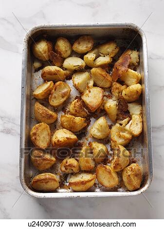 Stock Photo - Roast potatoes. Fotosearch