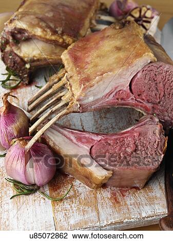 Stock Image - Roast rack of lamb. Fotosearch