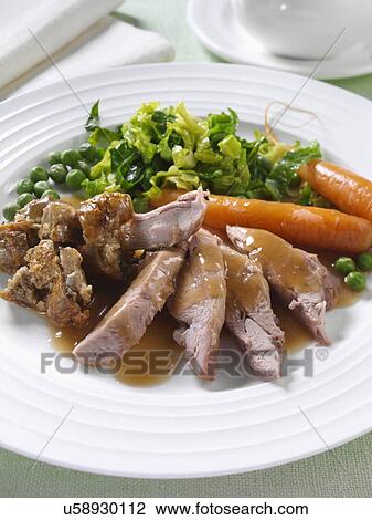 Roast turkey thigh with stuffing carrots cabbage peas and gravy View Large Photo Image Stock Image - Roast turkey thigh with stuffing carrots cabbage peas and gravy. Fotosearch