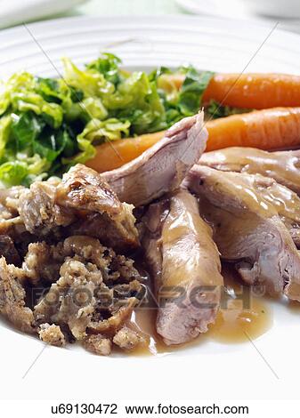 Roast turkey thigh with stuffing carrots cabbage peas and gravy View Large Photo Image Stock Image - Roast turkey thigh with stuffing carrots cabbage peas and gravy. Fotosearch