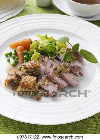 Roast turkey thigh with stuffing carrots cabbage peas and gravy View Large Photo Image Stock Image - Roast turkey thigh with stuffing carrots cabbage peas and gravy. Fotosearch