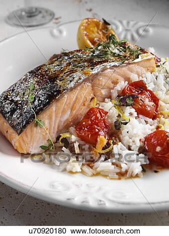 Roasted Salmon with cherry tomatoes and coconut rice View Large Photo Image Stock Image - Roasted Salmon with cherry tomatoes and coconut rice. Fotosearch
