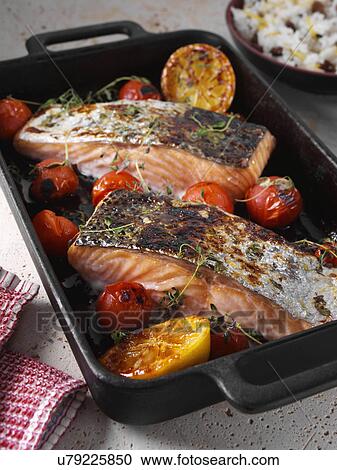 Roasted Salmon with cherry tomatoes and coconut rice View Large Photo Image Stock Image - Roasted Salmon with cherry tomatoes and coconut rice. Fotosearch