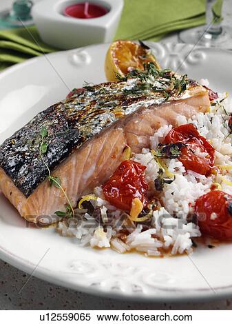 Roasted Salmon with cherry tomatoes and coconut rice View Large Photo Image Stock Photography - Roasted Salmon with cherry tomatoes and coconut rice. Fotosearch