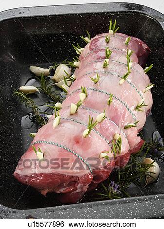 Stock Photograph - Rolled boned leg of lamb raw. Fotosearch