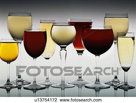 Stock Image - Row Of Assorted Red And White Wines In Wine Glasses. Fotosearch
