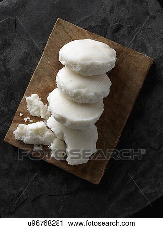 Sannas Goan rice bread on a wood platter View Large Photo Image Stock Image - Sannas Goan rice bread on a wood platter. Fotosearch