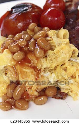Scrambled eggs baked beans tomatoes View Large Photo Image Stock Photography - Scrambled eggs baked beans tomatoes. Fotosearch