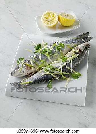 Sea bass cooked in foil with ginger and spring onions View Large Photo Image Stock Image - Sea bass cooked in foil with ginger and spring onions. Fotosearch