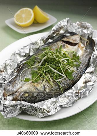 Sea bass cooked in foil with ginger and spring onions View Large Photo Image Stock Photo - Sea bass cooked in foil with ginger and spring onions. Fotosearch