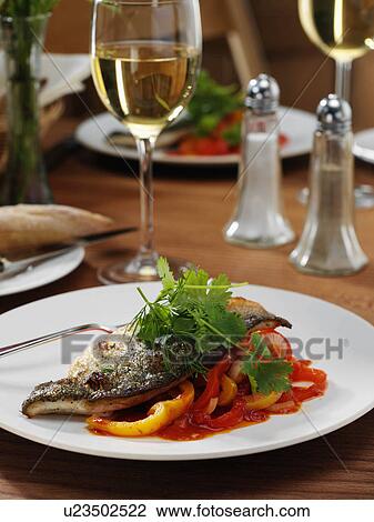 Sea bass in a restaurant table setting View Large Photo Image Stock Image - Sea bass in a restaurant table setting. Fotosearch