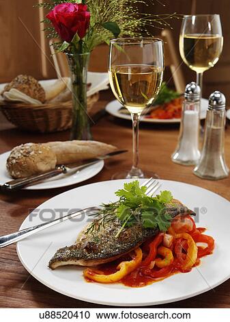 Sea bass in a restaurant table setting View Large Photo Image Stock Image - Sea bass in a restaurant table setting. Fotosearch