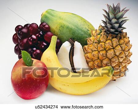 Selection Of Fresh, Fruit: Pineapple, Banana, Black Grapes, Coconut Slices, Papaya On White Background View Large Photo Image Picture - Selection Of Fresh, Fruit: Pineapple, Banana, Black Grapes, Coconut Slices, Papaya On White Background. Fotosearch